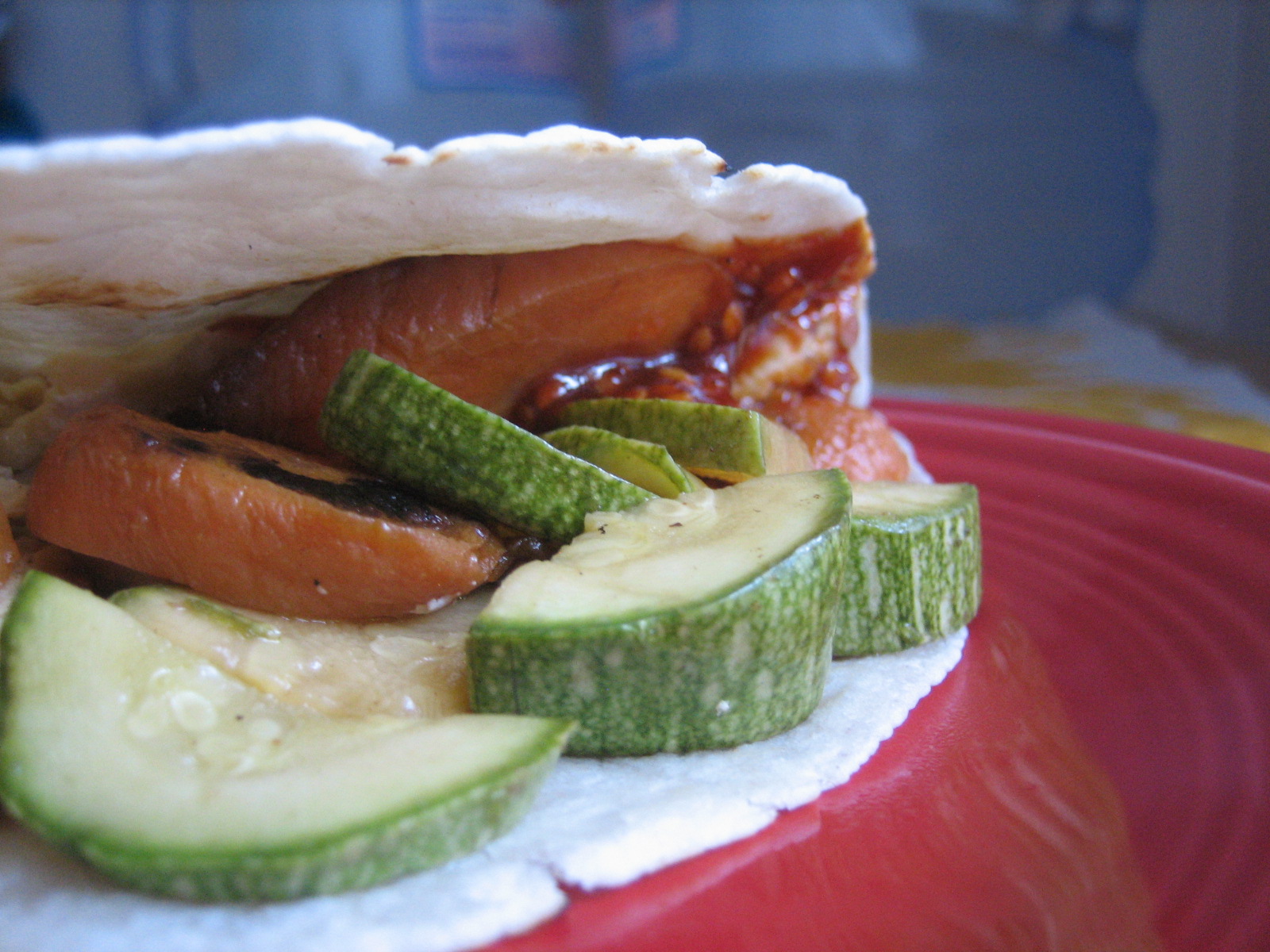 A close-up of roasted carrot and zucchini tacos... do you see the gooey red sauce? Yum! A close-up of roasted carrot and zucchini tacos... do you see the gooey red sauce? Yum!