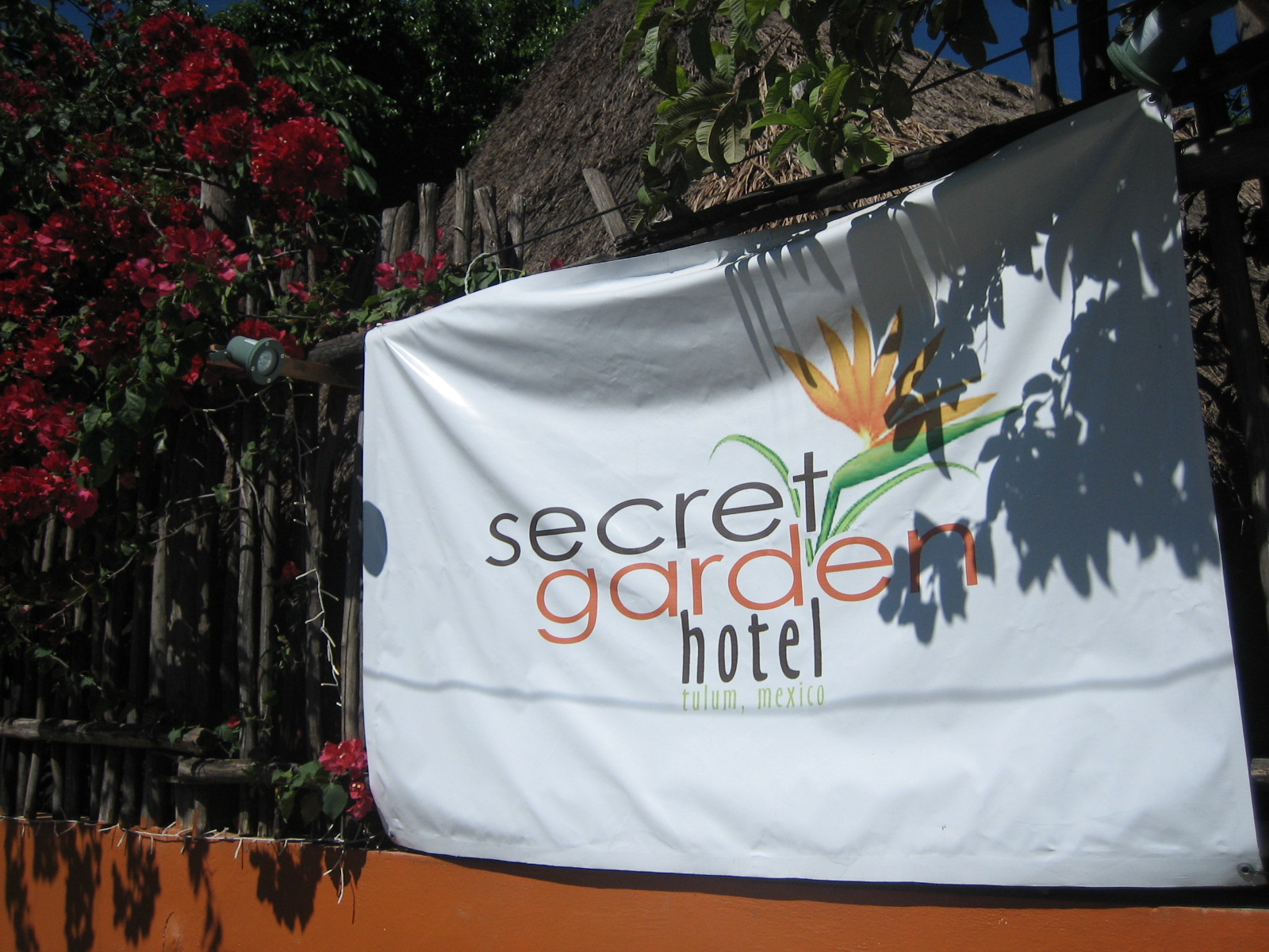 The sign for the Secret Garden Hotel in Tulum, Mexico