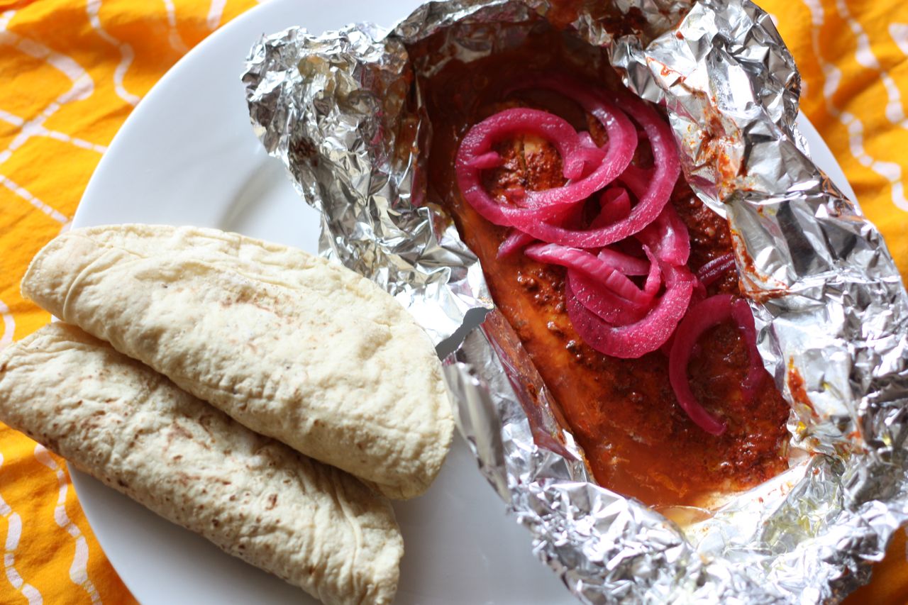 Tilapia pibil, served with corn tortillas