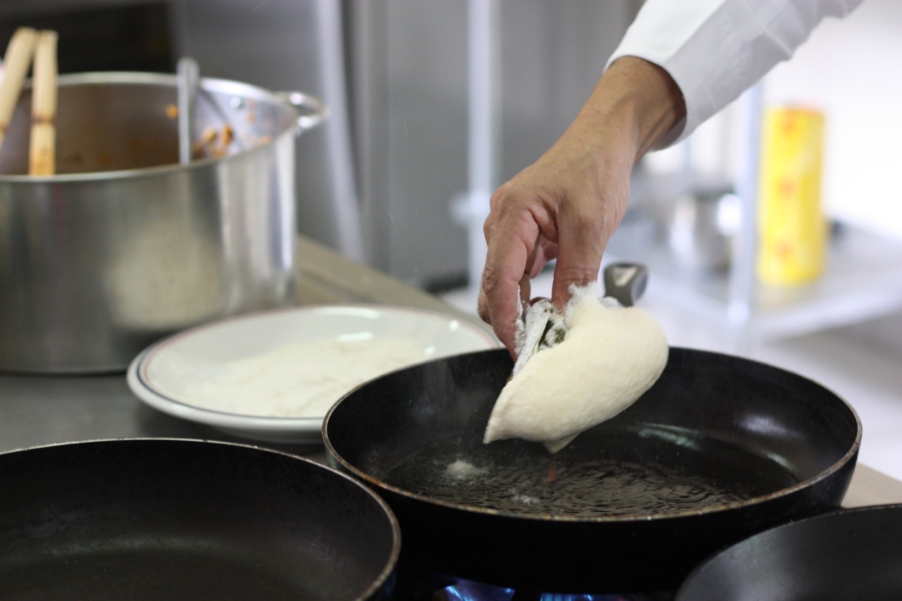 The egg-batter covered chile, about to hit the frying pan