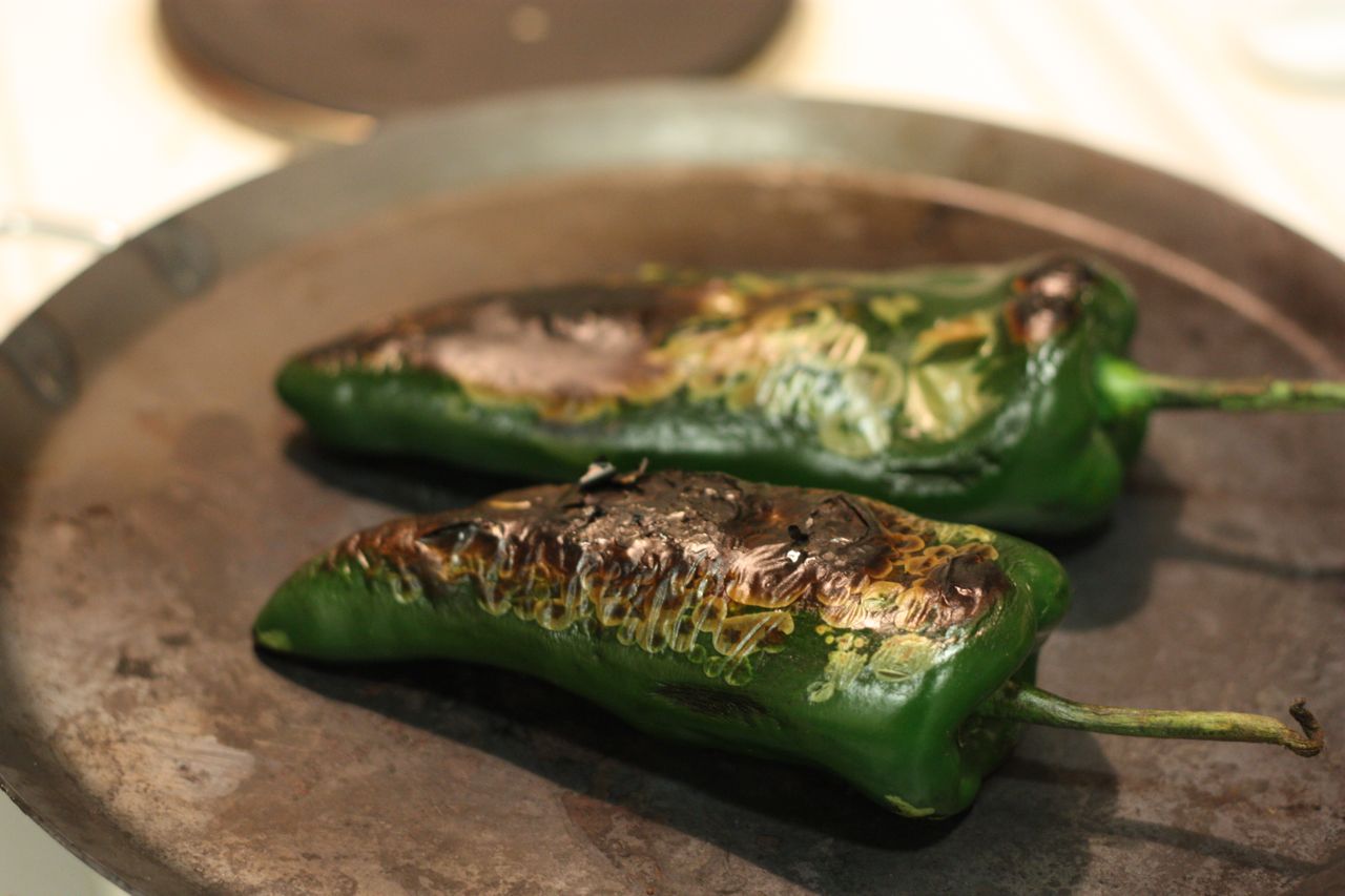 Poblano peppers roasting on the comal