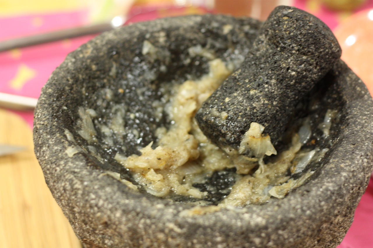 Roasted onion pieces, ground up in the molcajete