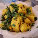Dhokla, a light, spicy garbanzo-flour cake generally eaten for breakfast.