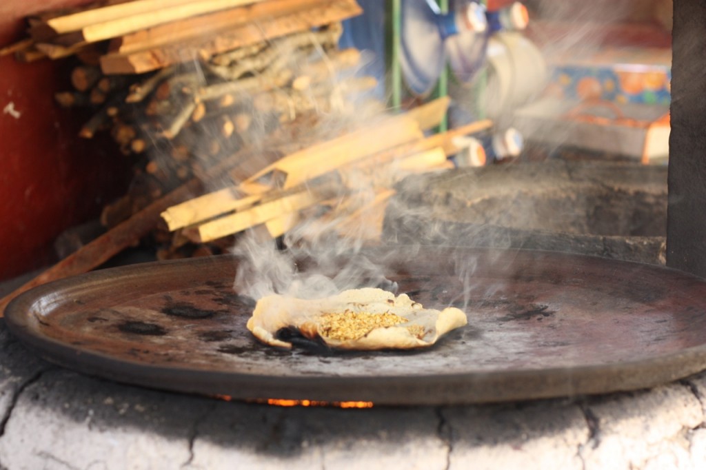 Burning a tortilla for chichilo mole